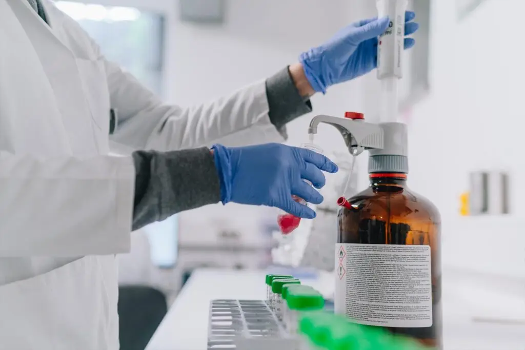 IEH lab worker using pre-calibrated pippette.