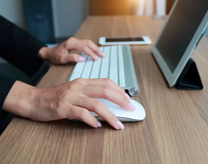 closeup businesswoman hands using smart phone and tablet